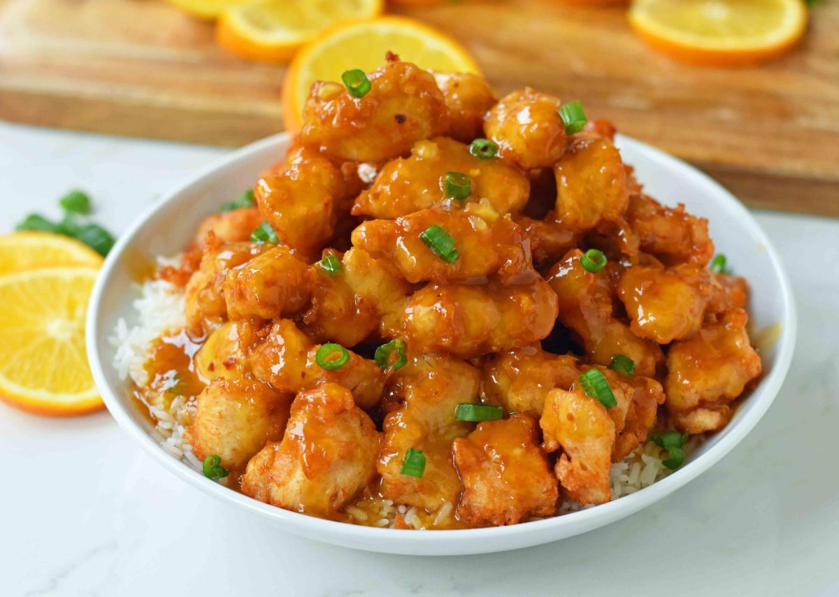 Orange chicken is a very popular meal and if your wanting to know how to make it, here is how!
INGREDIENTS 2 large eggs
1/4 c. all-purpose flour
1/2 c. plus 1 tbsp. cornstarch, divided
Kosher salt
Freshly ground black pepper
2 lb boneless and skinless chicken breasts, cut into 1 pieces
1 tablespoon canola oil, plus more for frying
2 cloves garlic, finely chopped
1/2 teaspoon  finely chopped peeled ginger
1/2 teaspoon crushed red pepper flakes
2/3 c. fresh orange juice
2 tablespoon hoisin sauce
2 tablespoon reduced-sodium soy sauce
2 tablespoon sweet chili sauce
1 tablespoon apple cider vinegar
1 tablespoon brown sugar
Juice of 1/2 lemon
2 scallions sliced
Cooked white rice
How to Make:
1. In a bowl, add eggs and beat until blended.
2. In  a separate bowl, mix flour and 1/2 cup of cornstarch, season with salt and black pepper. Coat the chicken first in egg and then toss into flour mixture. 
3. In a skillet, pour oil, heat until hot and add the chicken and fry until brown and crispy for 4 to 5 minutes.
4. In a saucepan, whisk cornstarch with 2 tablespoons of water and whisk until it is syrupy for 5 minutes. 
5. Move the chicken onto a bowl, toss to combine.
6. Enjoy